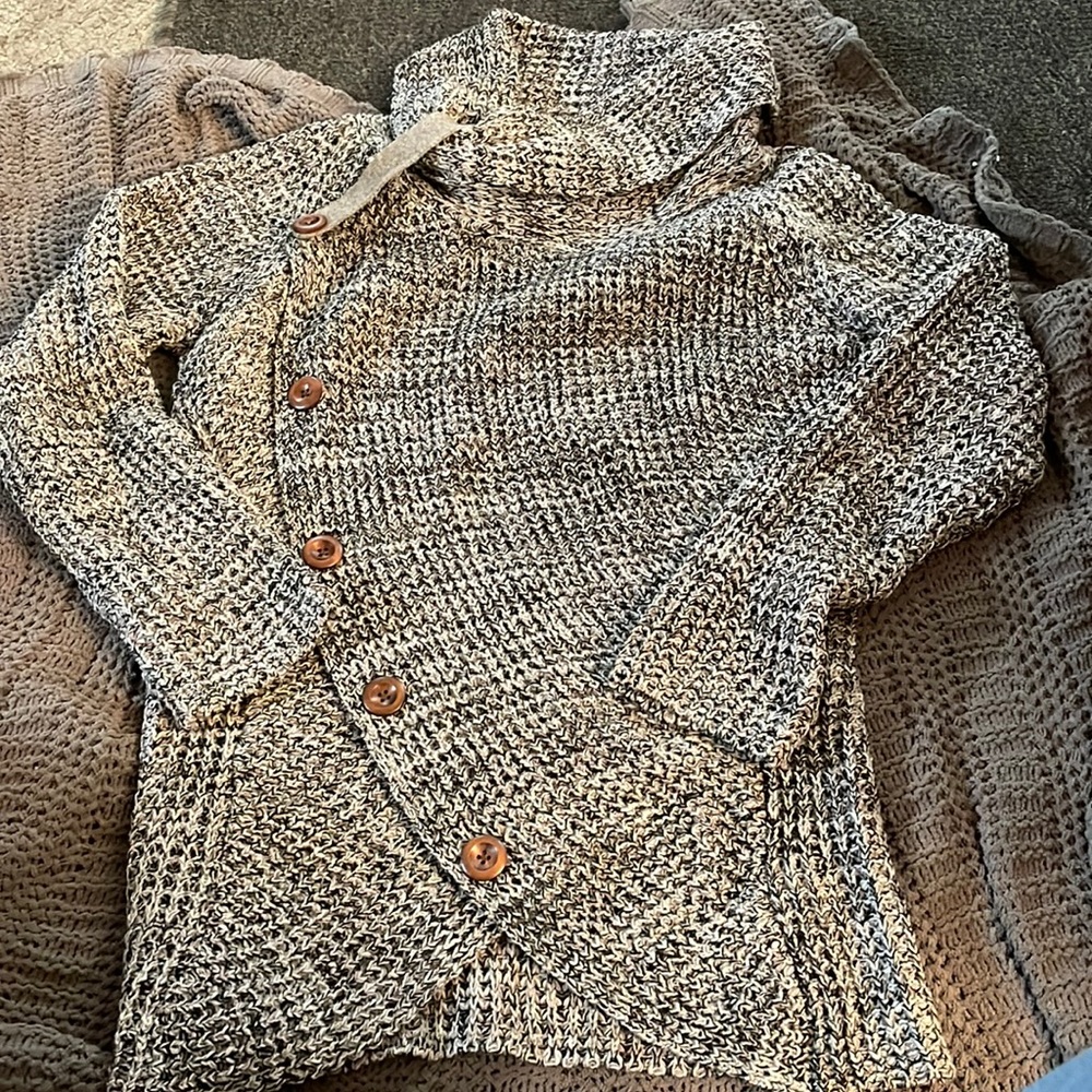 Black and gray sweater. 100% acrylic. Size 2X. Has asymmetrical button detail.